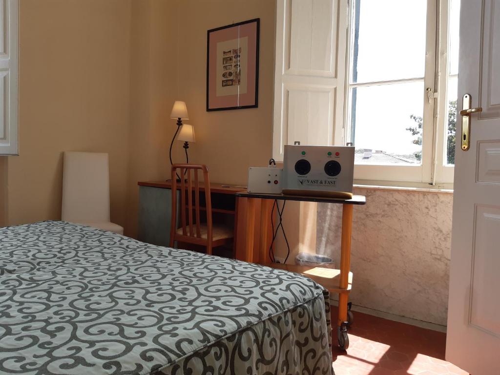 Łóżko lub łóżka w pokoju w obiekcie Hotel Italia