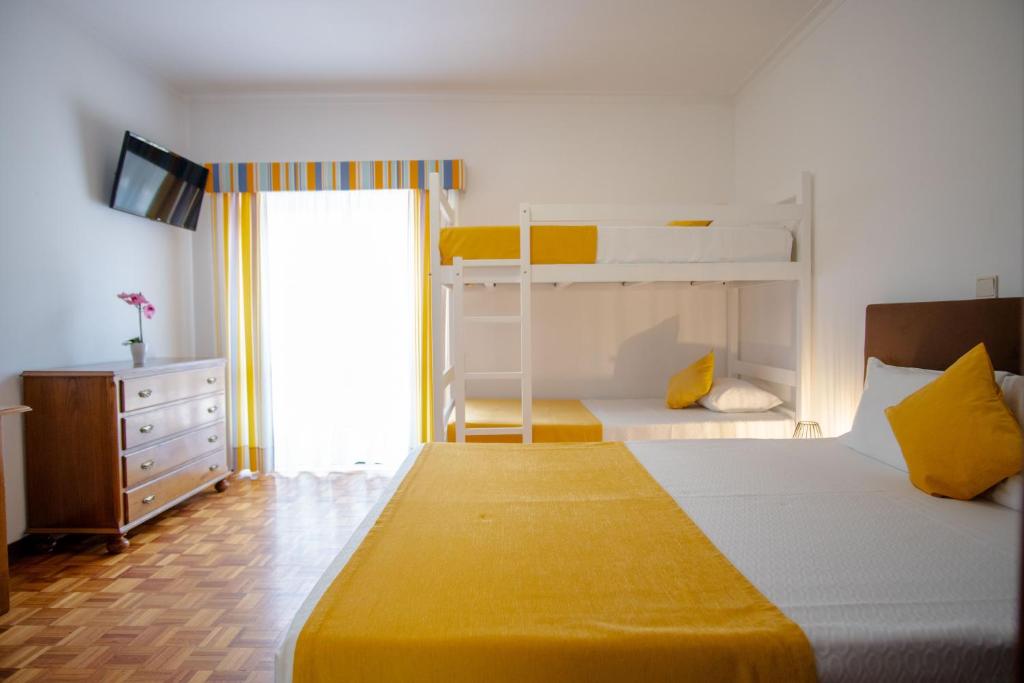 Postel nebo postele na pokoji v ubytování Gerês Guest House