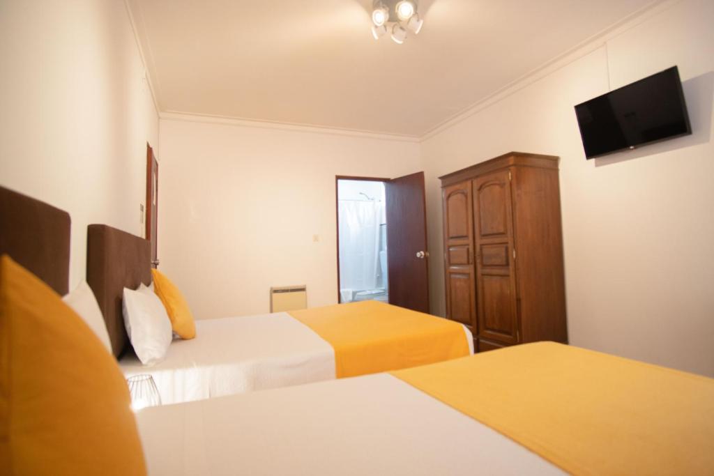 Postel nebo postele na pokoji v ubytování Gerês Guest House