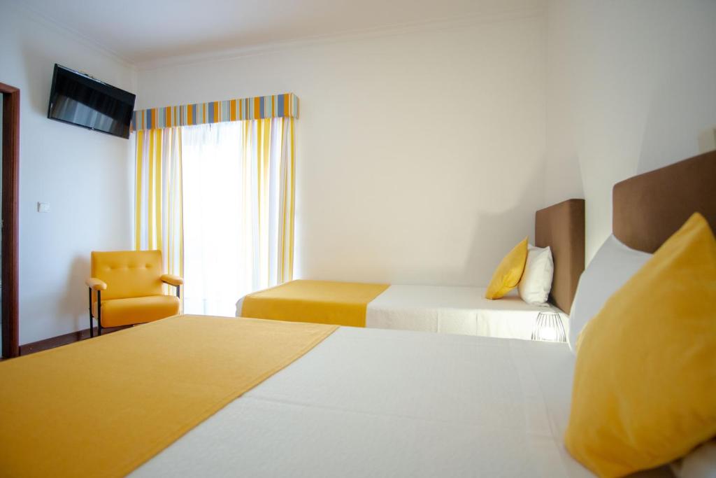 Postel nebo postele na pokoji v ubytování Gerês Guest House
