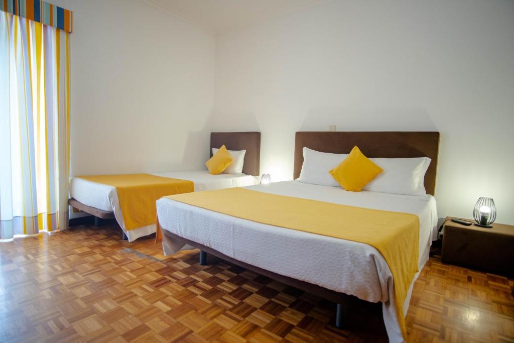 Postel nebo postele na pokoji v ubytování Gerês Guest House