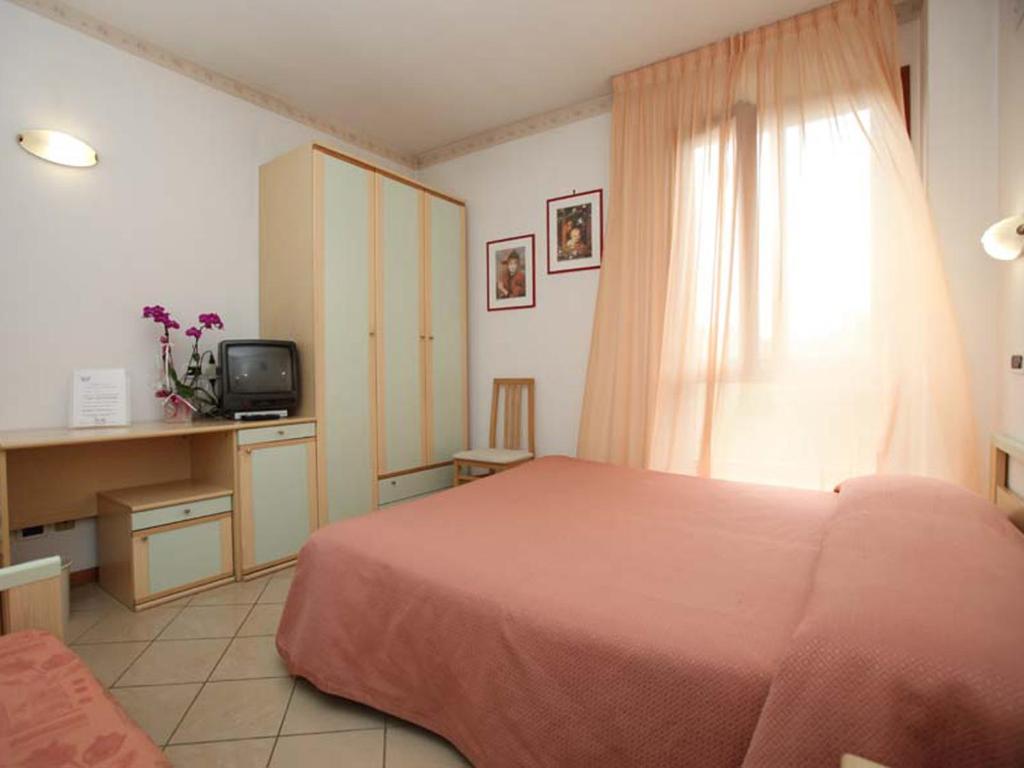 Postel nebo postele na pokoji v ubytování Albergo Bice
