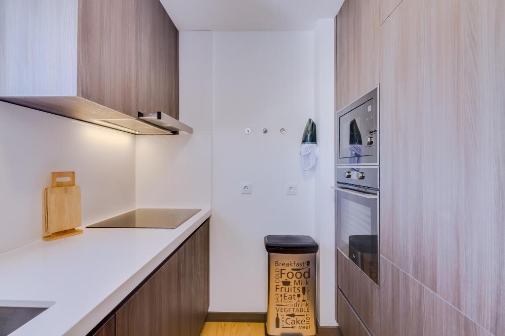 Kuchyň nebo kuchyňský kout v ubytování Gold Suites - Luxurious apartment - Sea view