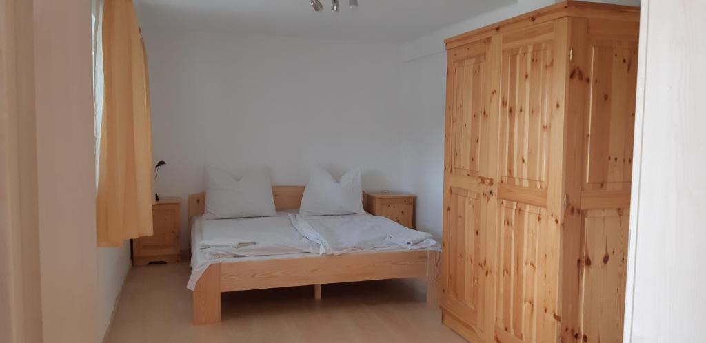Postel nebo postele na pokoji v ubytování Jankó Apartman