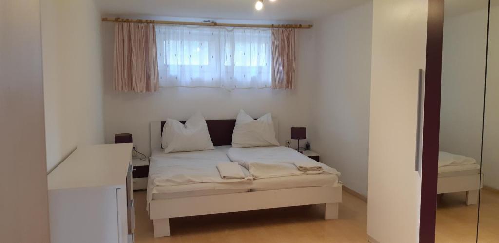 Postel nebo postele na pokoji v ubytování Jankó Apartman