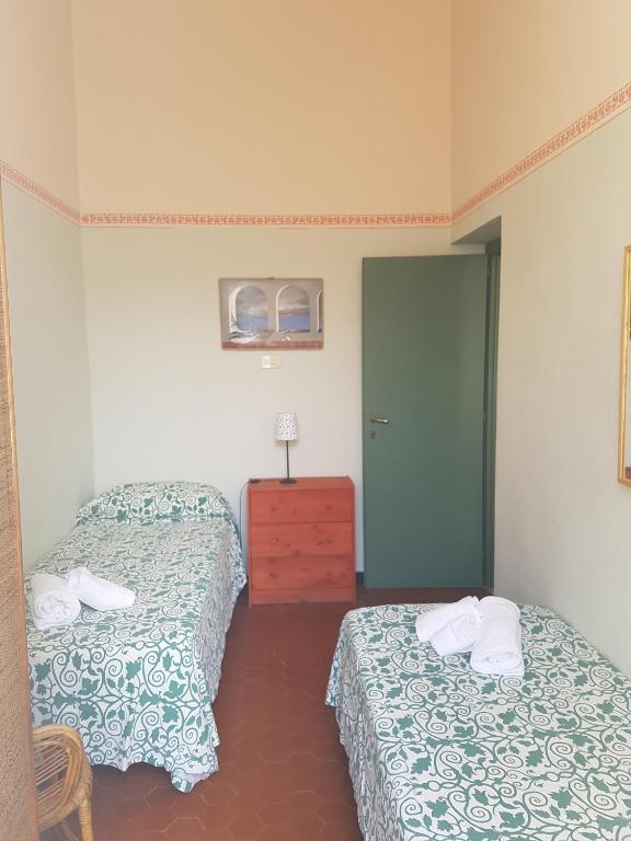 Postel nebo postele na pokoji v ubytování Albergo Lungomare