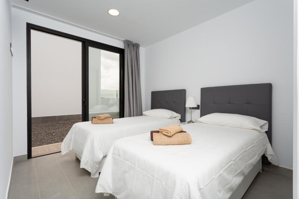 Postel nebo postele na pokoji v ubytování Villas Mariposas Dreams