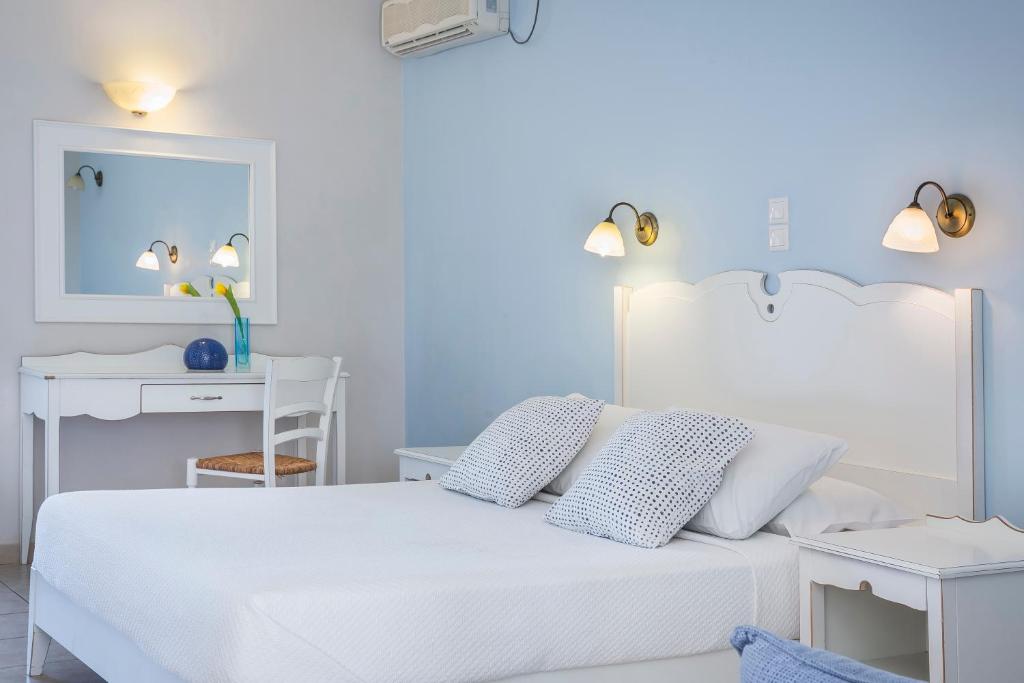 Postel nebo postele na pokoji v ubytování ASTRA Village Resort