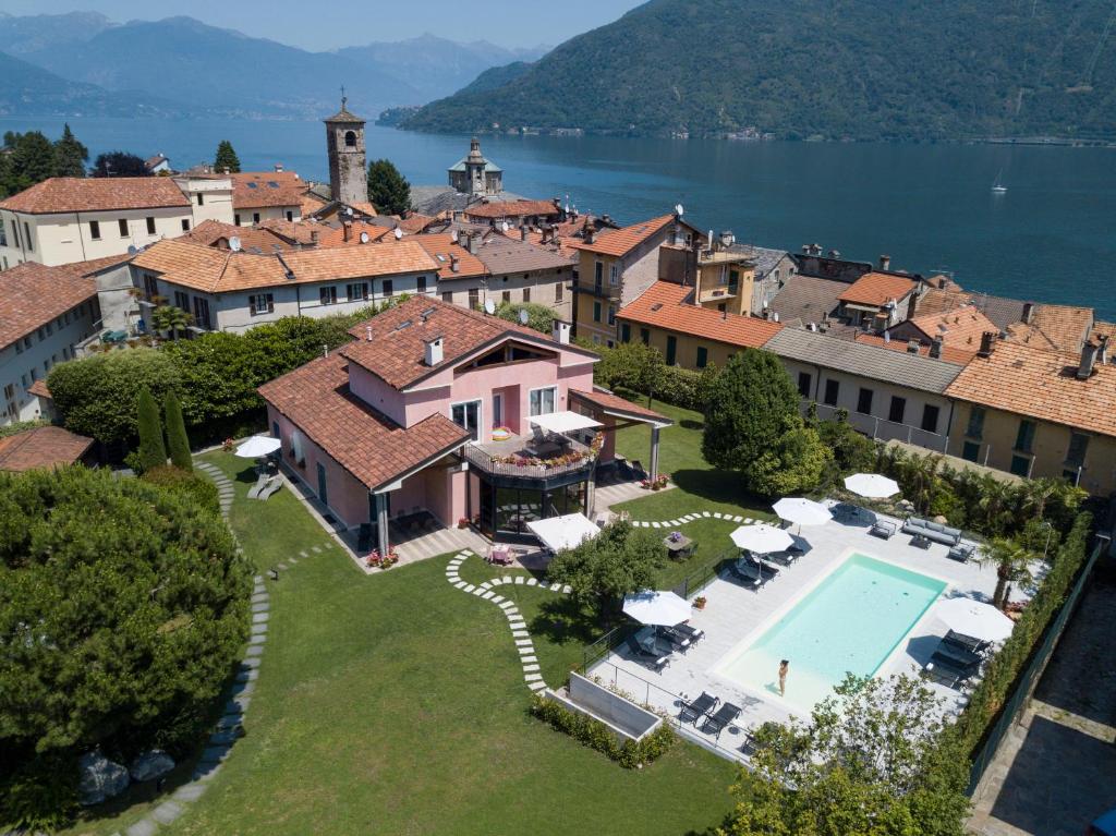 an aerial view of a house with a swimming pool at Villa Costantina with heated POOL in Cannobio