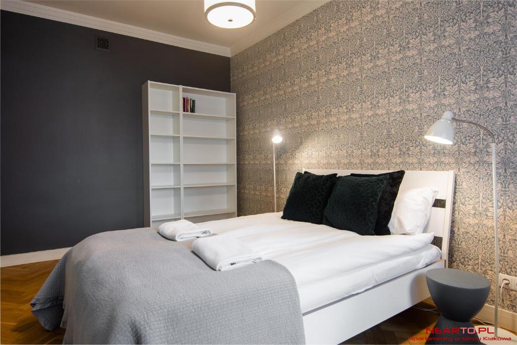 Postel nebo postele na pokoji v ubytování Apartment Nearto Old Town Daszyńskiego street