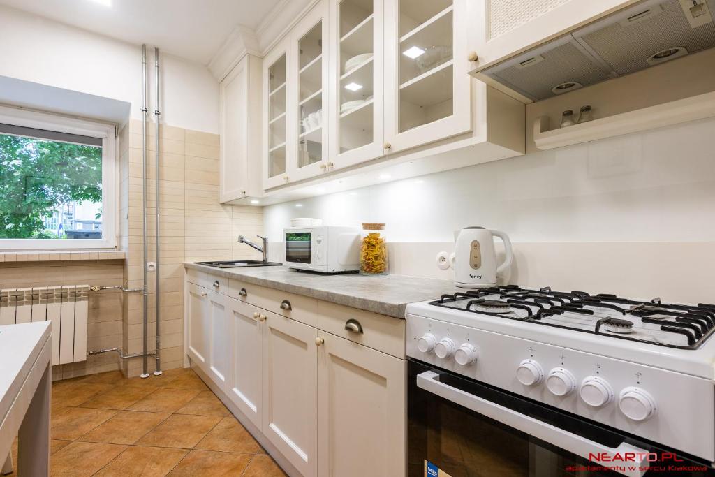 Kuchyň nebo kuchyňský kout v ubytování Apartment Nearto Old Town Daszyńskiego street