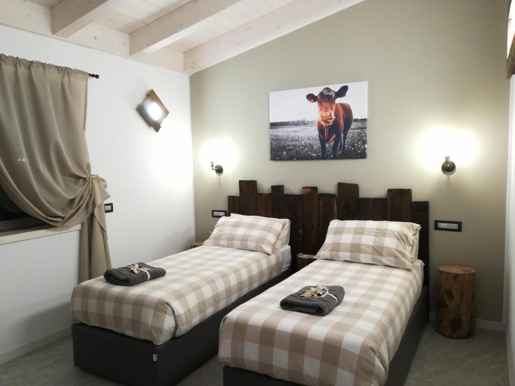 Postel nebo postele na pokoji v ubytování Arbulé Agriturismo & Spa Valtellina