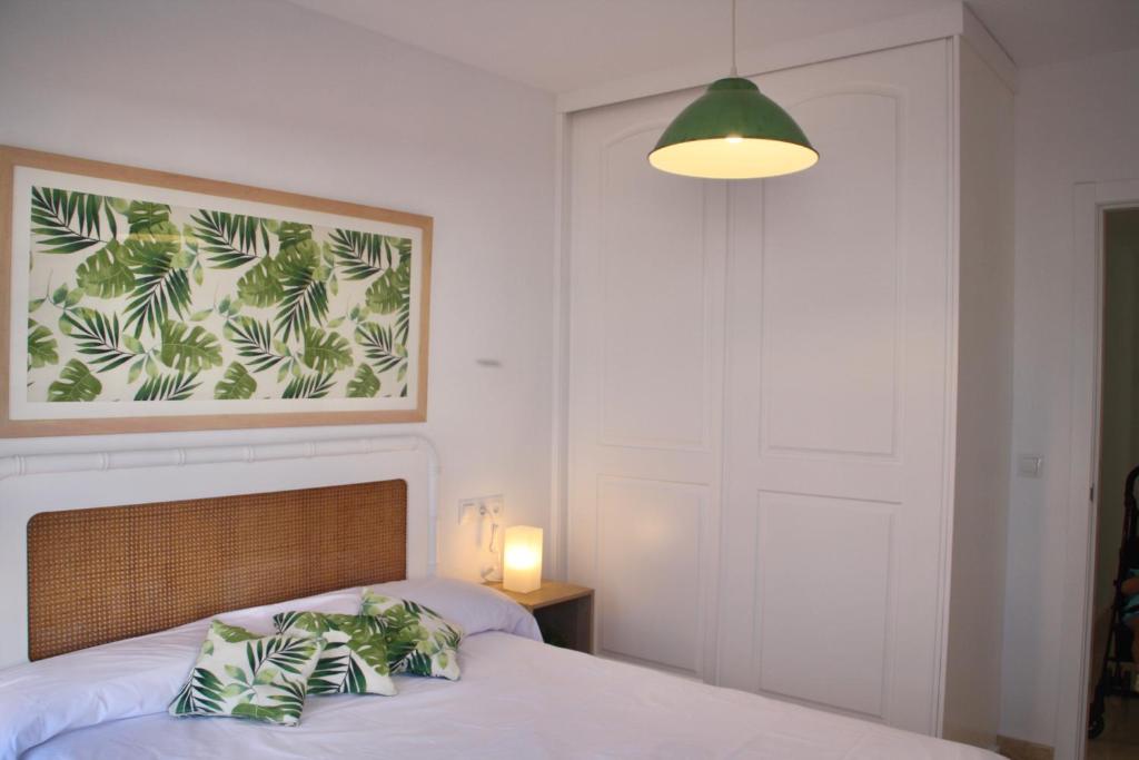 A bed or beds in a room at Nuevo apartamento en pleno centro