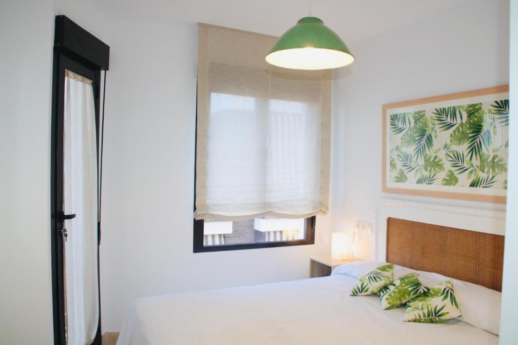 A bed or beds in a room at Nuevo apartamento en pleno centro