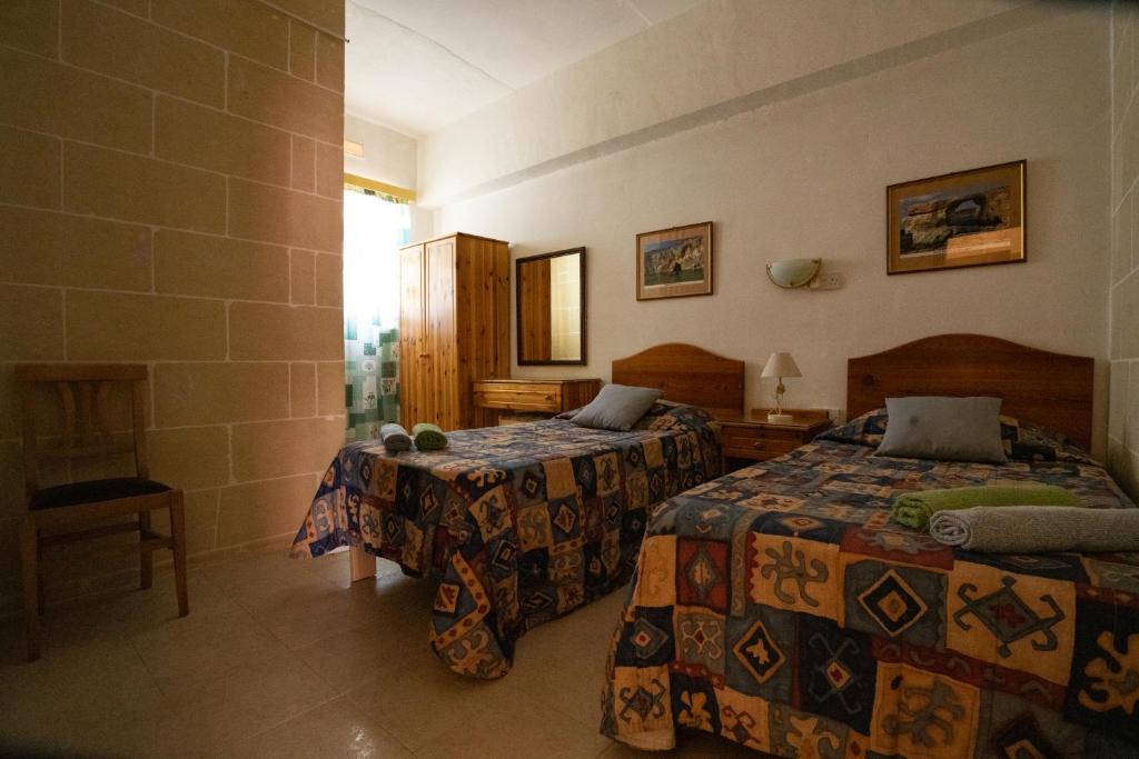 Postel nebo postele na pokoji v ubytování Sunset Seaview Apartments
