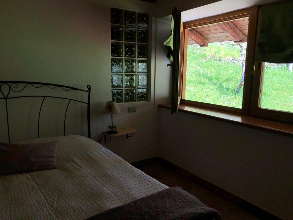 Posteľ alebo postele v izbe v ubytovaní B&B Maso Zont Antico Maso