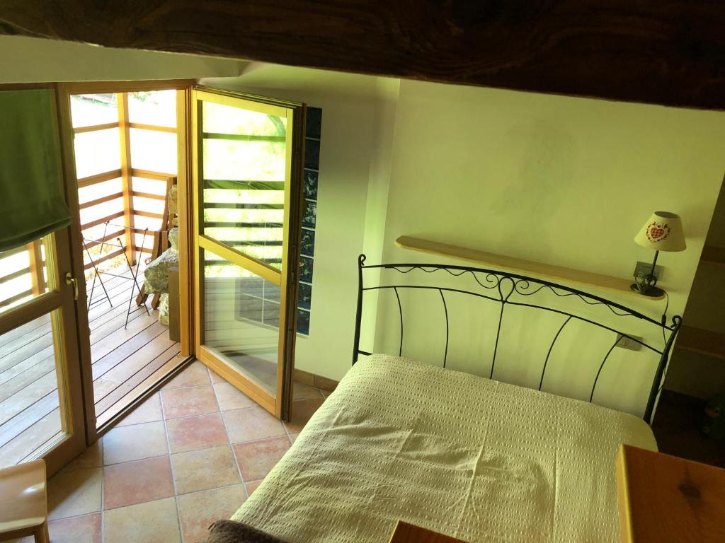 Posteľ alebo postele v izbe v ubytovaní B&B Maso Zont Antico Maso