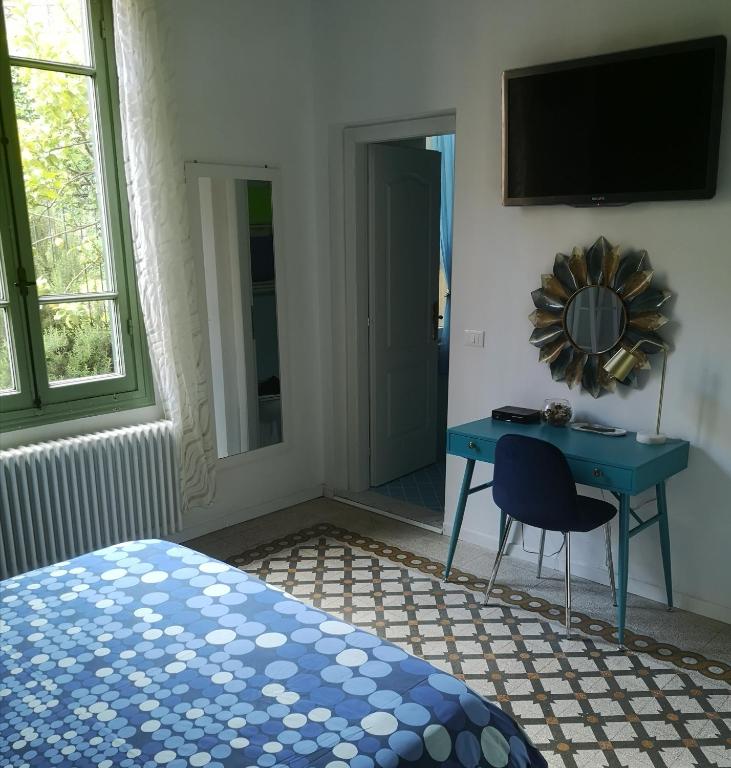Letto o letti in una camera di Villa Corsini