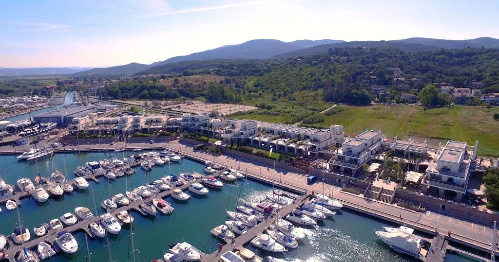 an aerial view of a marina with boats in the water at Marina di Scarlino Resort in Puntone di Scarlino