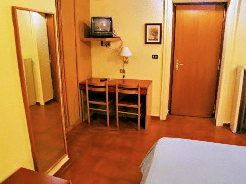 Postel nebo postele na pokoji v ubytování Hotel Minerva