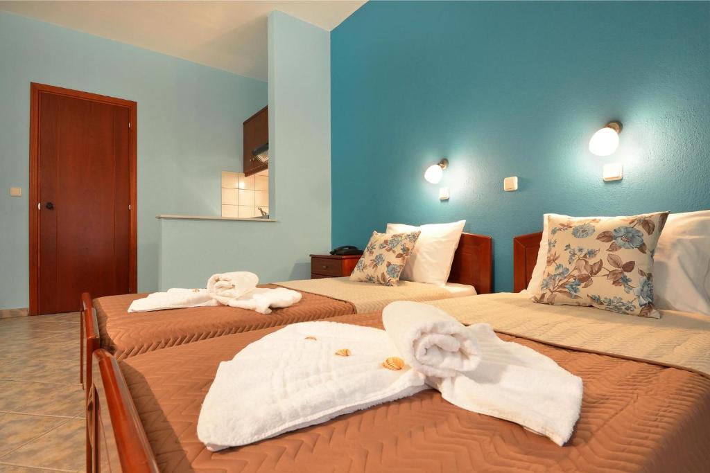 Postel nebo postele na pokoji v ubytování Hotel Stefanos
