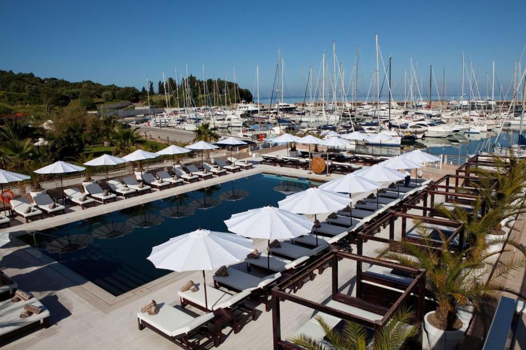 an aerial view of a marina with chairs and umbrellas at Marina di Scarlino Resort in Puntone di Scarlino