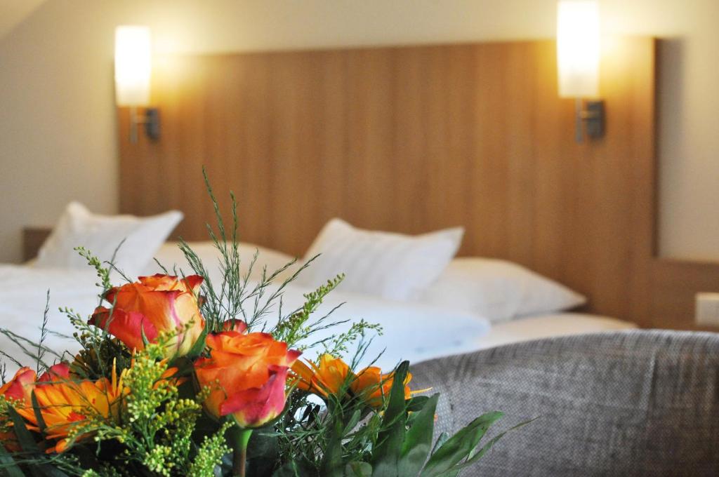 Postel nebo postele na pokoji v ubytování Hotel Fortuna