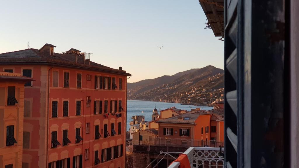 a view of the water from a city with buildings at La Scialuppa in Camogli