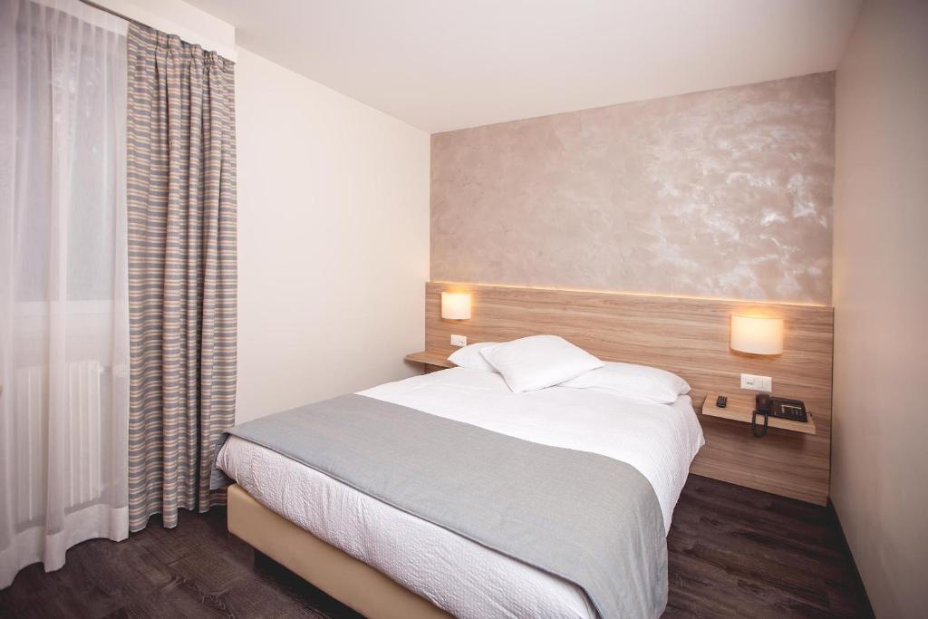 Letto o letti in una camera di Hôtel de Chailly