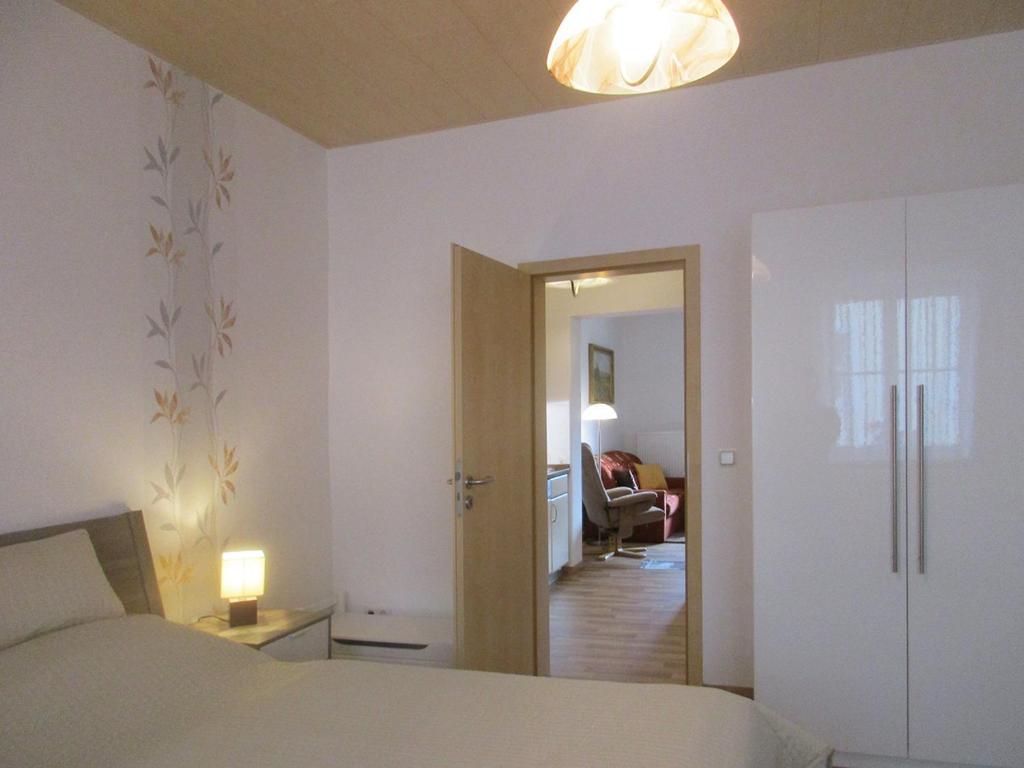 Postel nebo postele na pokoji v ubytování Ferienwohnung Schrammsteine