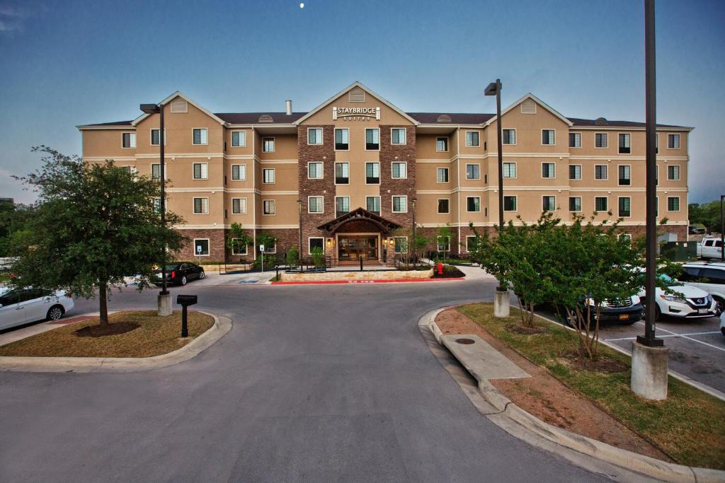 a large building with a clock on the side of it at Staybridge Suites Austin South Interstate Hwy 35, an IHG Hotel in Austin