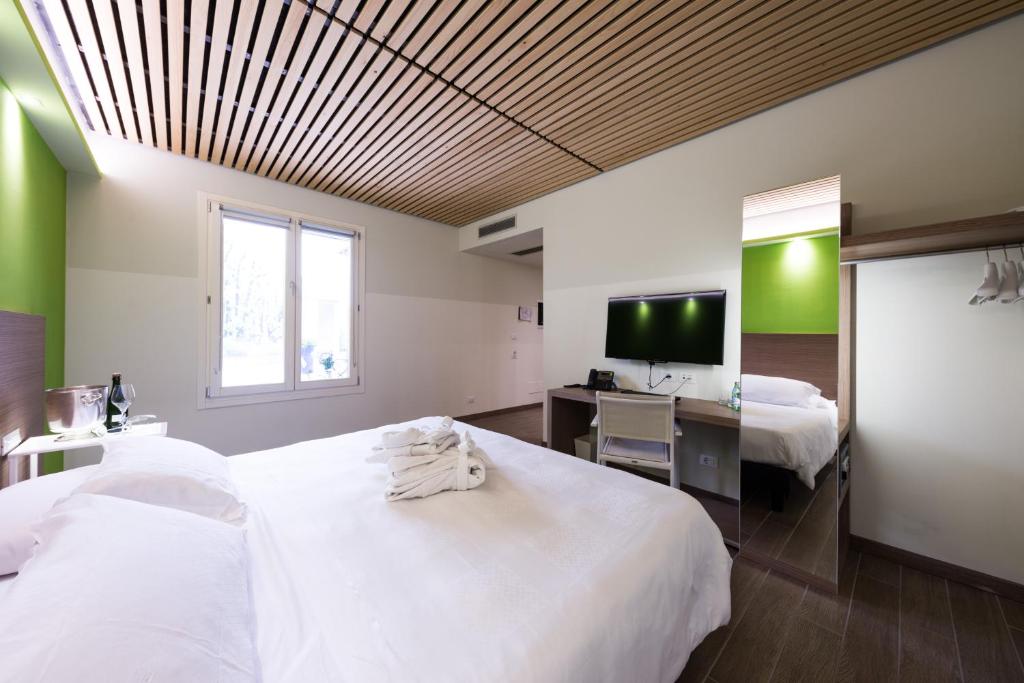 Postel nebo postele na pokoji v ubytování Hotel Marelet