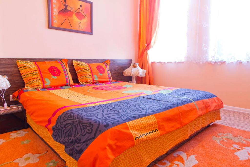 Postel nebo postele na pokoji v ubytování Orange Flower Apartments