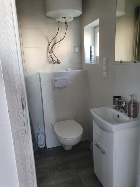 Koupelna v ubytování Apartamenty Tęczowa 14 Sarbinowo