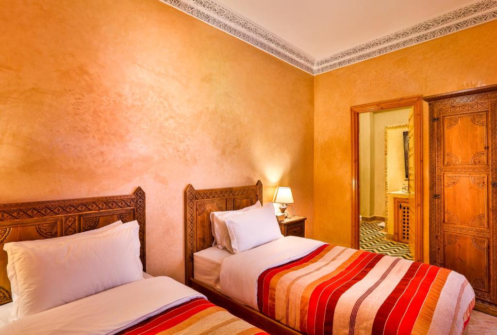 Postel nebo postele na pokoji v ubytování RIAD VILLA SIDI BABA