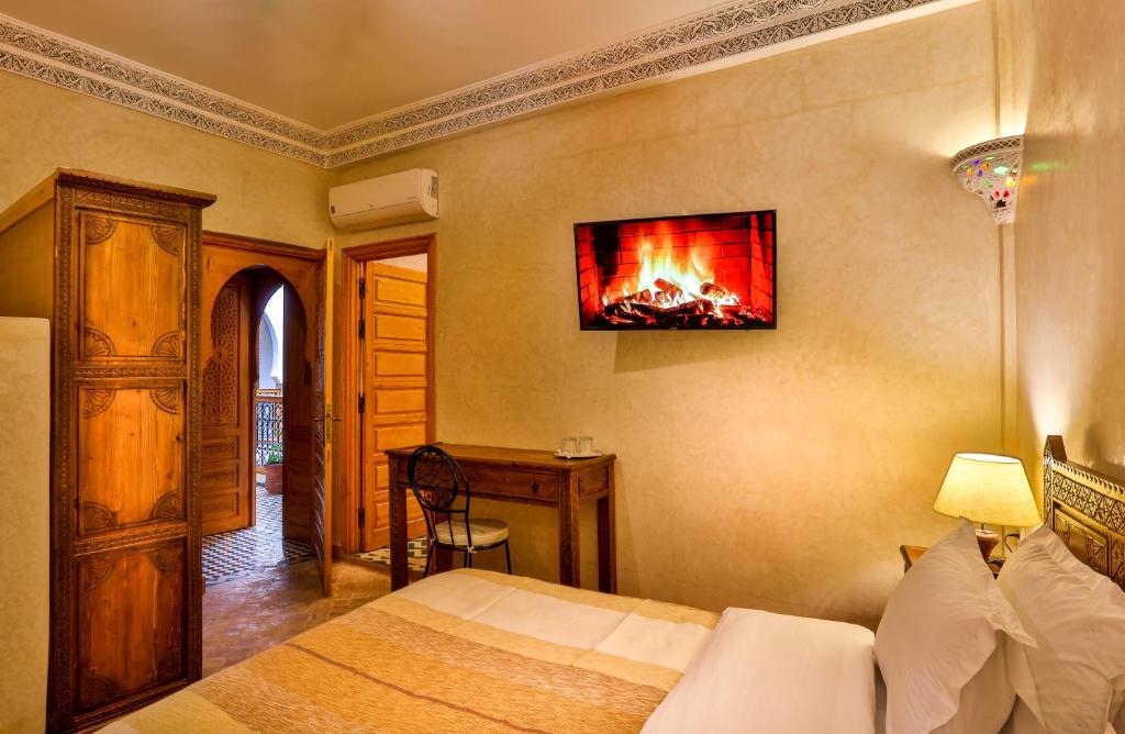 Postel nebo postele na pokoji v ubytování RIAD VILLA SIDI BABA
