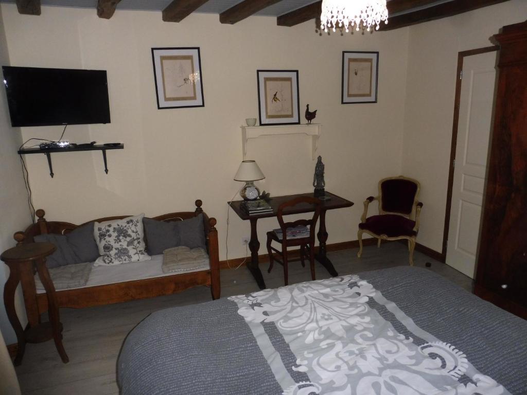 Postel nebo postele na pokoji v ubytování Chambre d'hôtes des 3 ifs