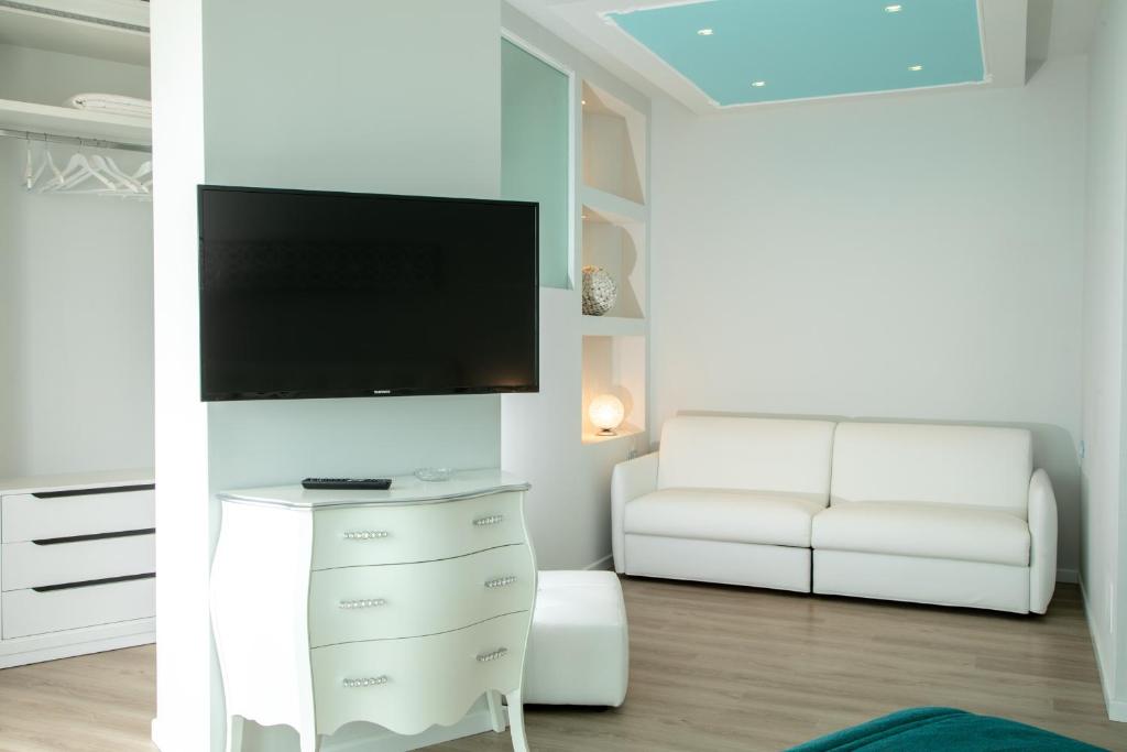 TV a/nebo společenská místnost v ubytování Hotel Carlton