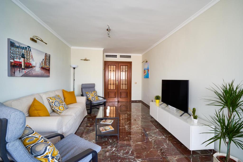 Televízia a/alebo spoločenská miestnosť v ubytovaní Apartamento Málaga City Center