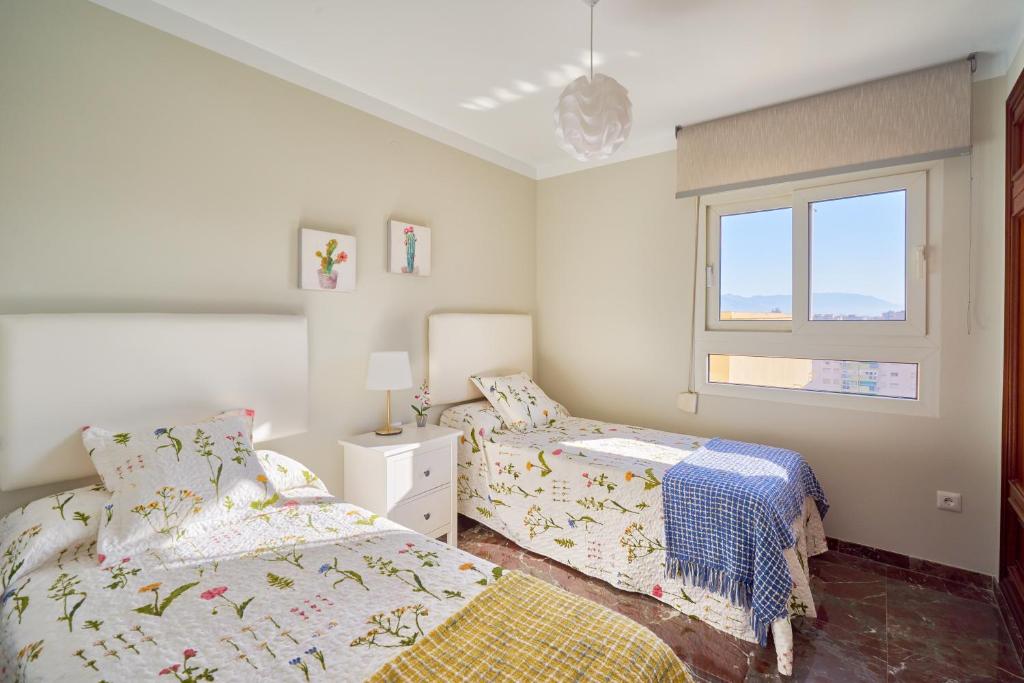 Posteľ alebo postele v izbe v ubytovaní Apartamento Málaga City Center