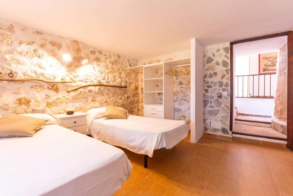Tempat tidur dalam kamar di Molí D,en Barret