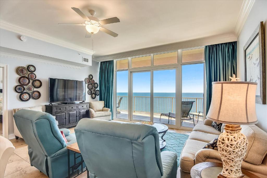 a living room with a view of the ocean at Phoenix Gulf Shores Unit 1702 in Gulf Shores
