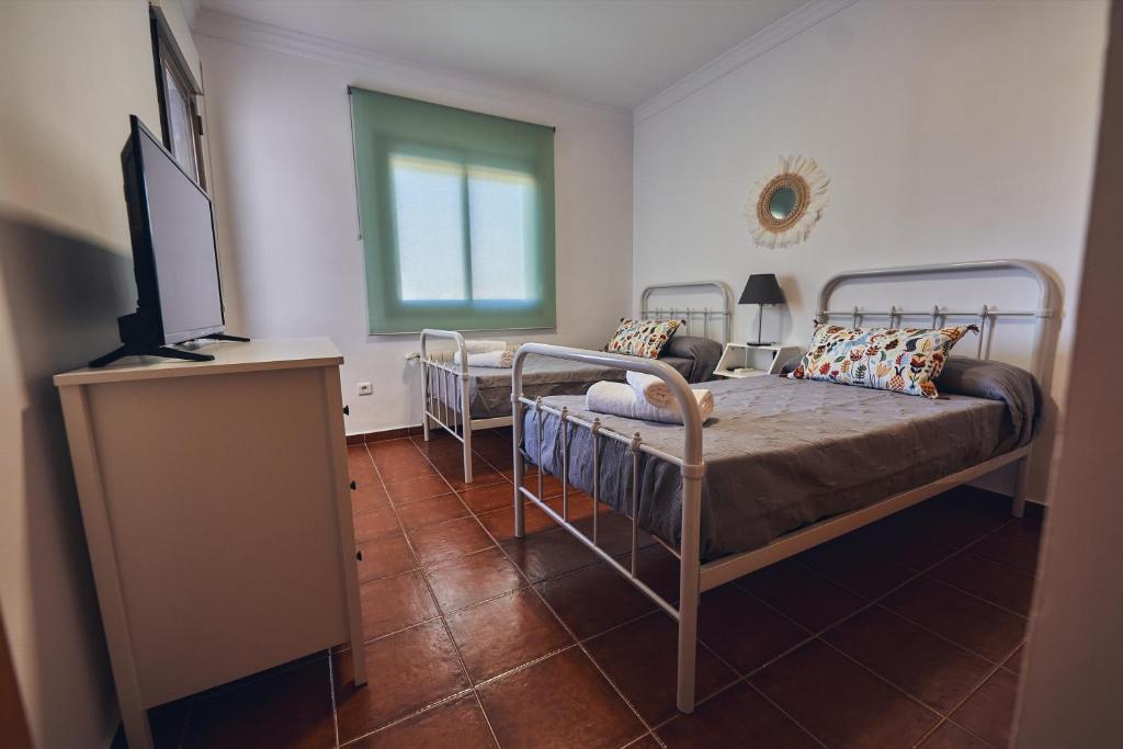 Postel nebo postele na pokoji v ubytování La Casa del Barrio - Ronda