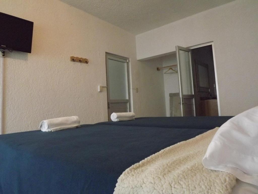 Postel nebo postele na pokoji v ubytování La Catrina Hostel