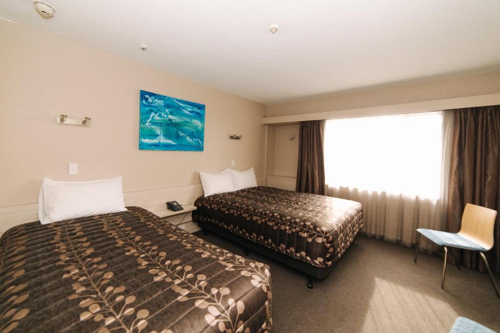 Postel nebo postele na pokoji v ubytování Brydone Hotel Oamaru