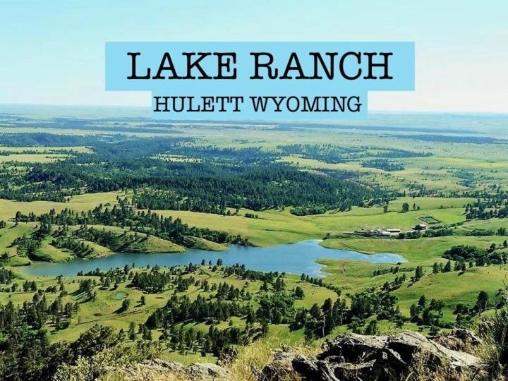 a lake ranch with the words lake ranchearchigham at lake guest ranch in Devils Tower