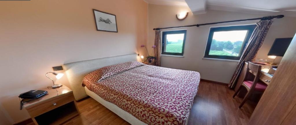 Postel nebo postele na pokoji v ubytování Parc Hotel Casa Mia