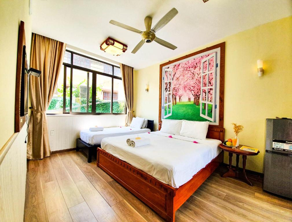 Postel nebo postele na pokoji v ubytování Anh Family Homestay
