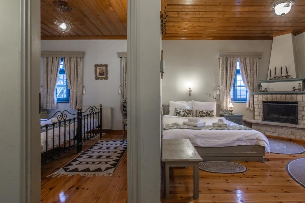 Postel nebo postele na pokoji v ubytování Andromachi's beloi hotel