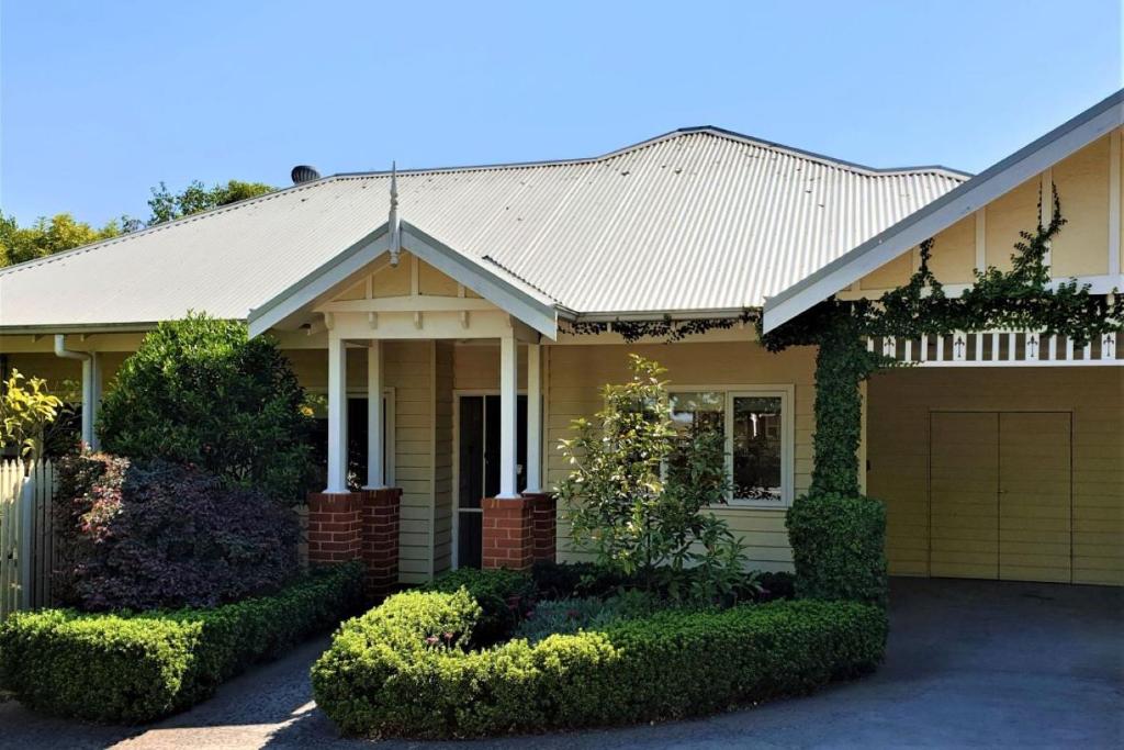 a house with a garage in front of it at Healesville House - Fig Tree House in Healesville